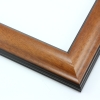 This simple, reverse curve frame features a red-brown wash with a alight sheen, that highlights the natural wood grain.  The subtly bevelled inner and outer edges are matte black.

1.75 " width: ideal for small or medium size images.  The plain, natural appearance of this frame makes it a great border for almost any artwork: photograph, painting or giclee print.